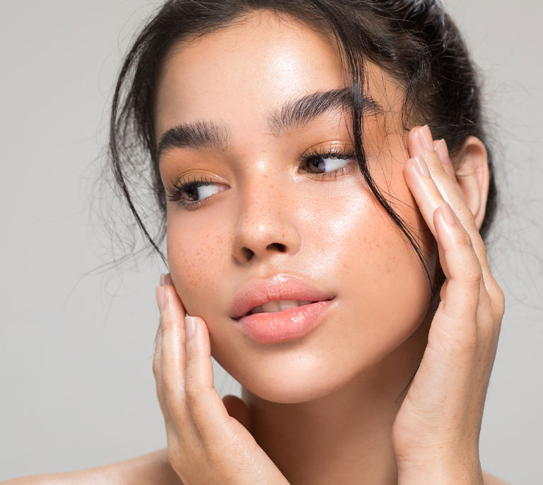 a close up of Daniela Braga talking on a cell phone