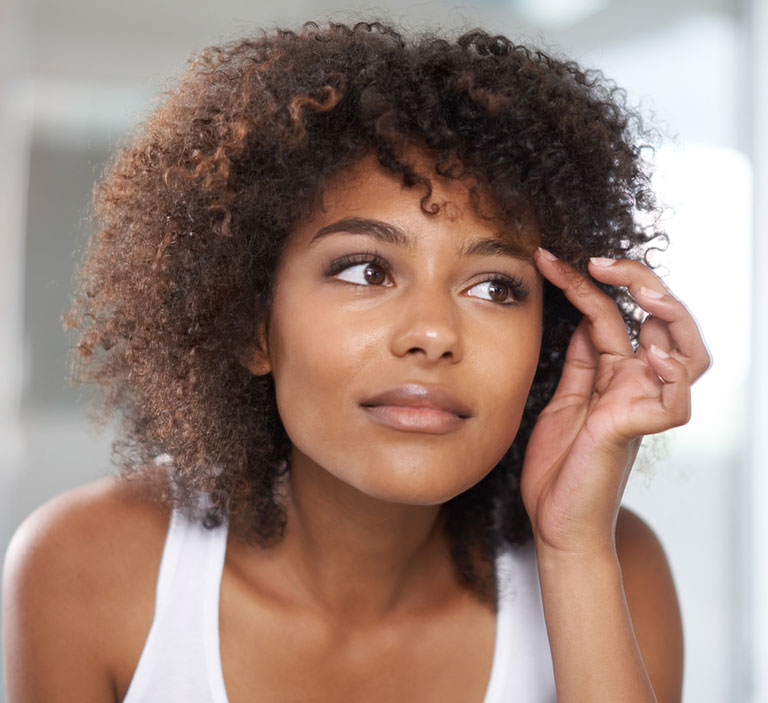a close up of a person talking on a cell phone
