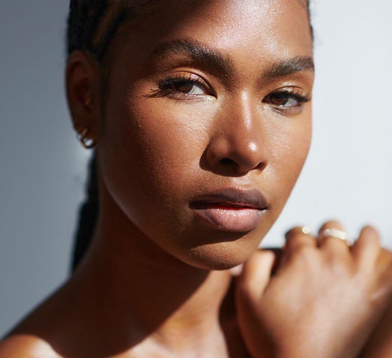 a close up of a person looking towards the camera